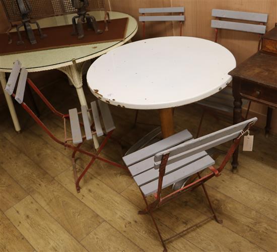 A garden table and four folding chairs W.85cm